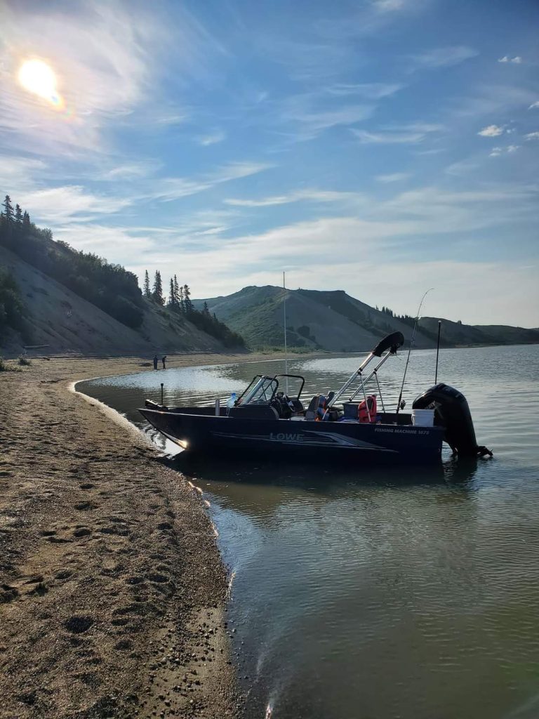Sandy Hills on Mackenzie River seen from a Polar Pack Arctic Adventures boat tour in the NWT.