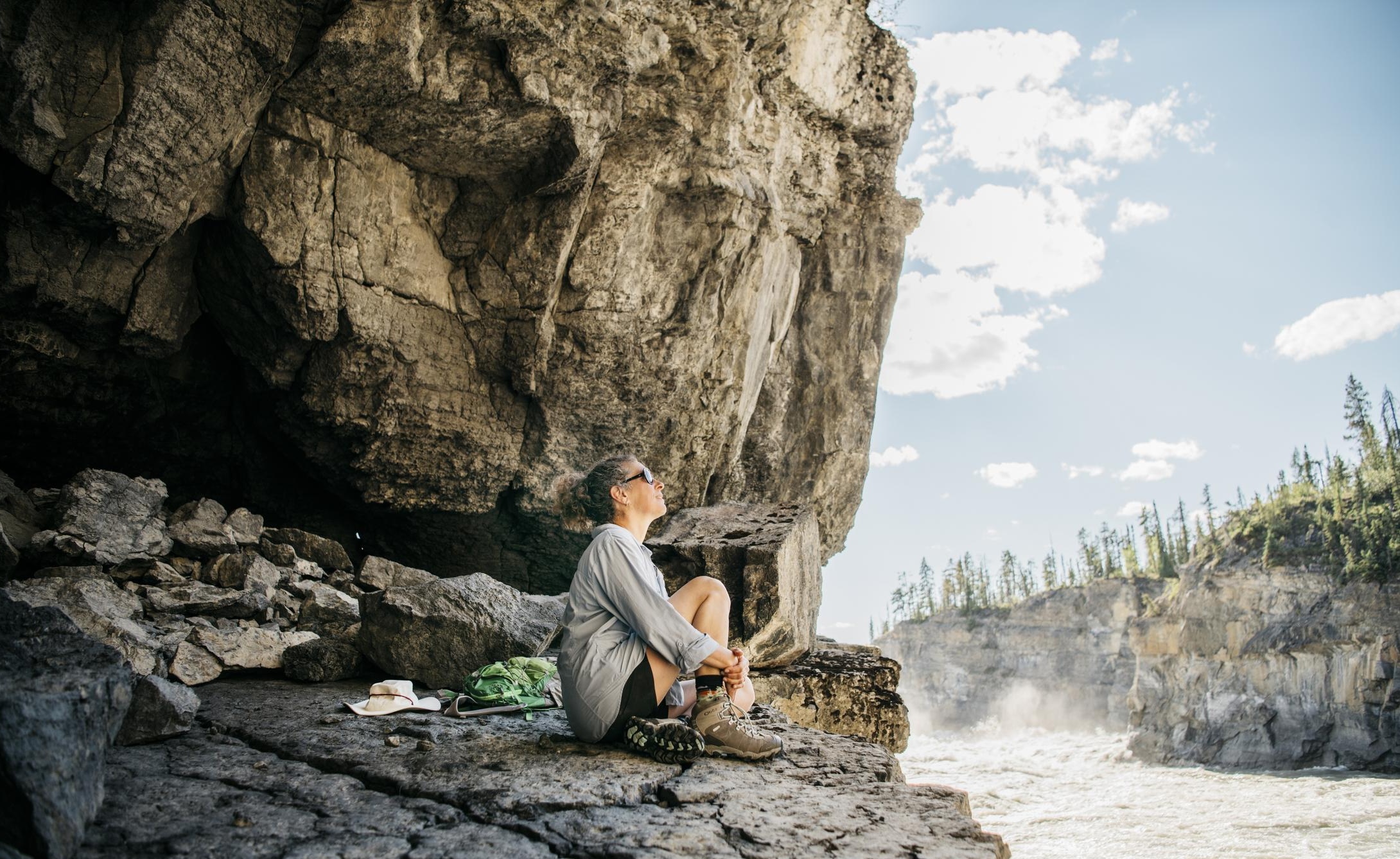 Nahanni National Park waterfall. Person enjoying the spectaular NWT