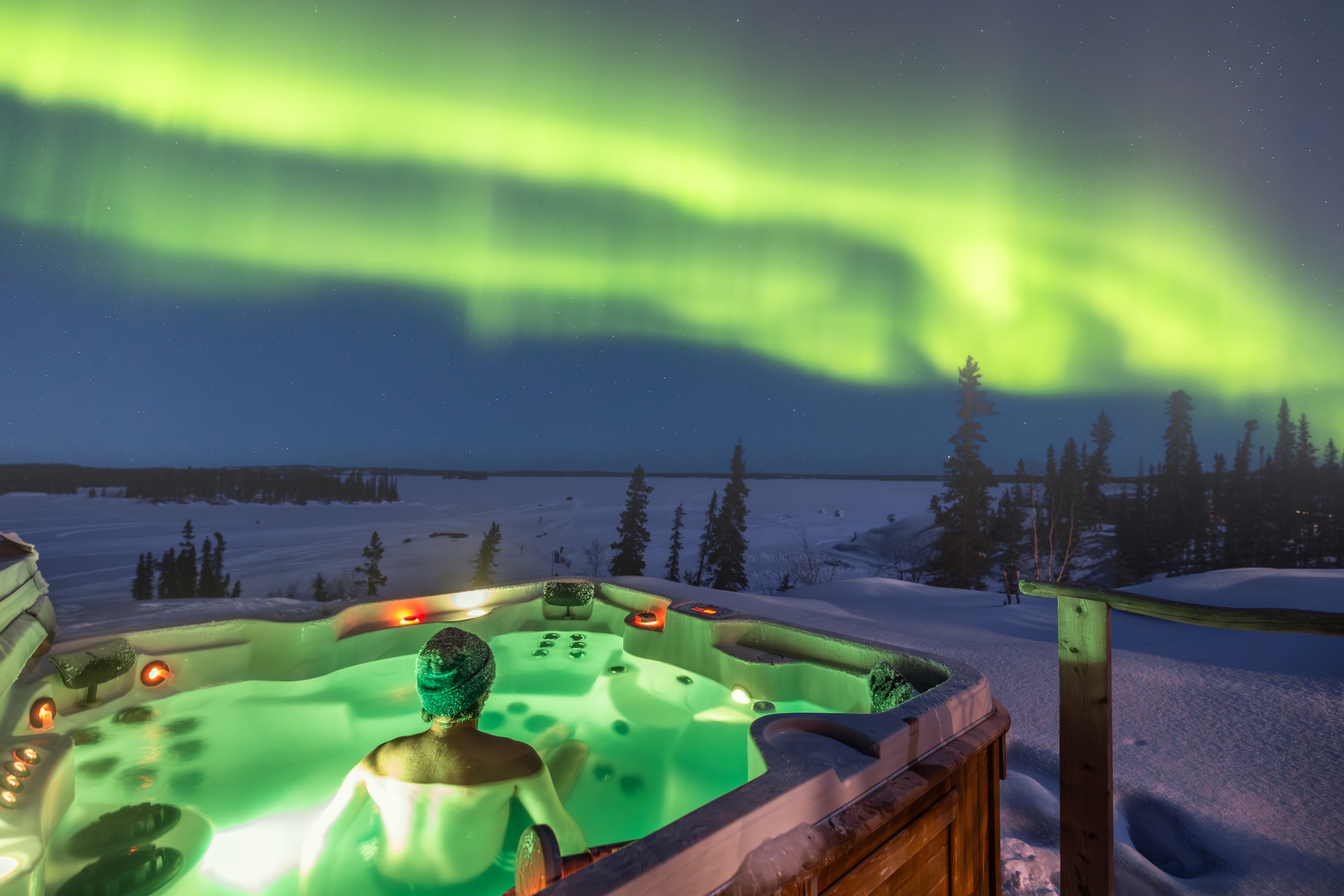 Northern lights over a hot tub in the Northwest territories, best place to see the Northern lights.